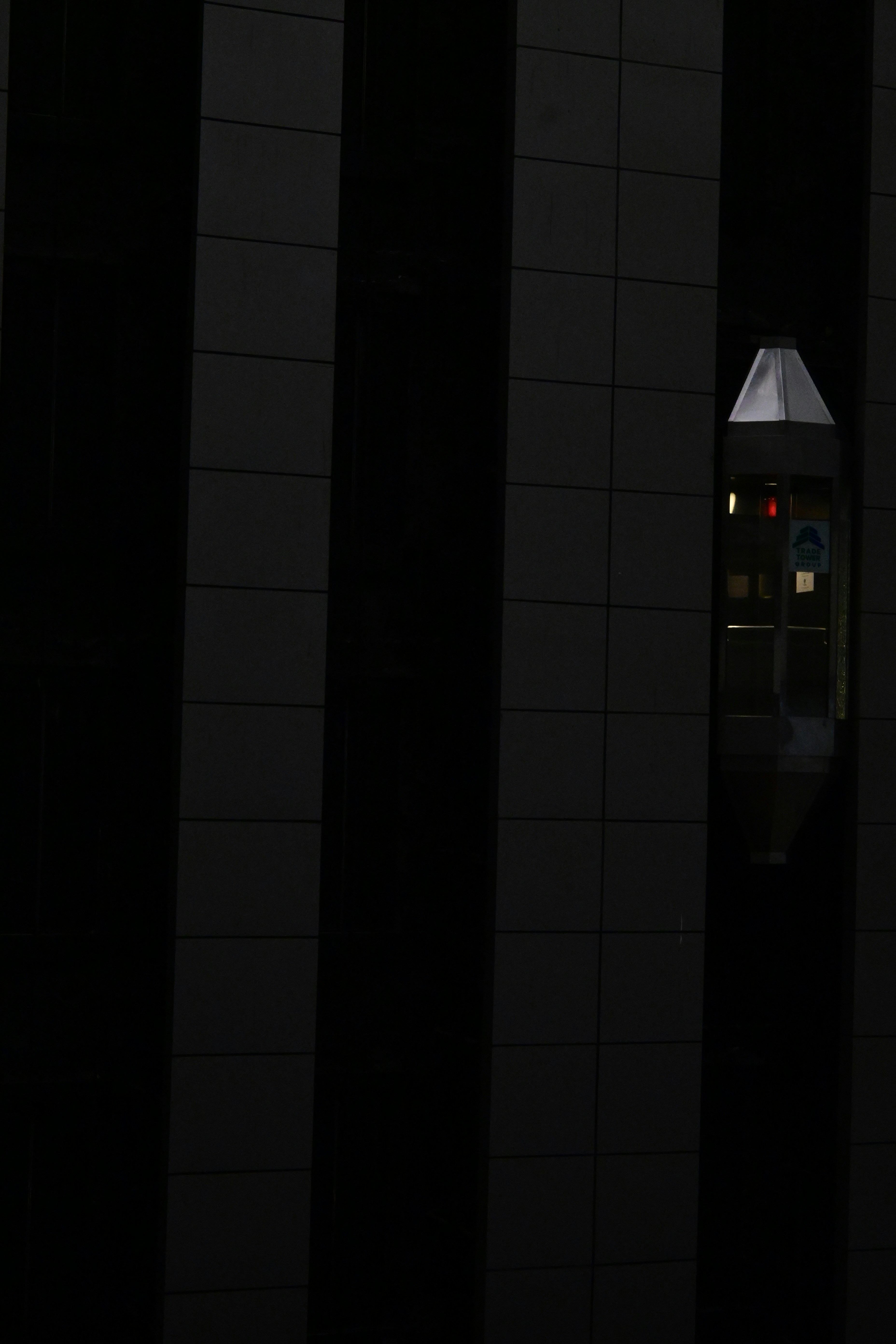 As I watched the empty elevator come down through my lens. It sparked a sense of uncertainty in my mind.